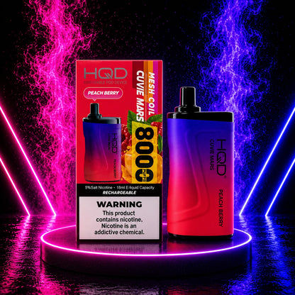 HQD Cuvie Mars 8000 Peach Berry disposable vape with rechargeable battery, mesh coil, 8000 puffs, and retail packaging displayed on a neon pink and blue background at Pink Smoke Shop.